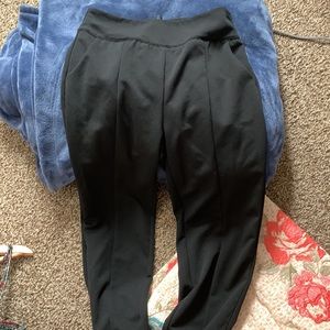 Black slacks with gold zipper